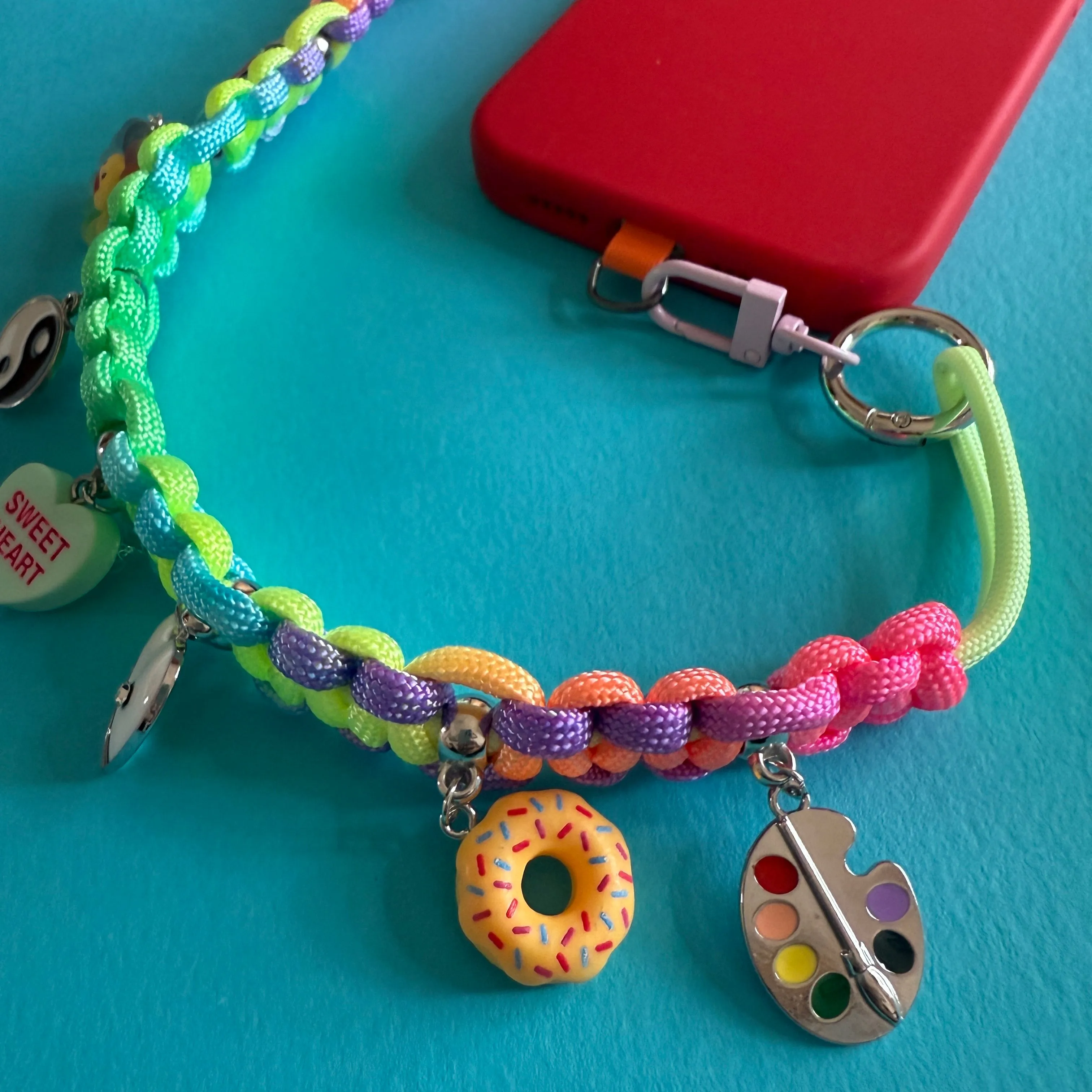 Phone wrist strap with charms